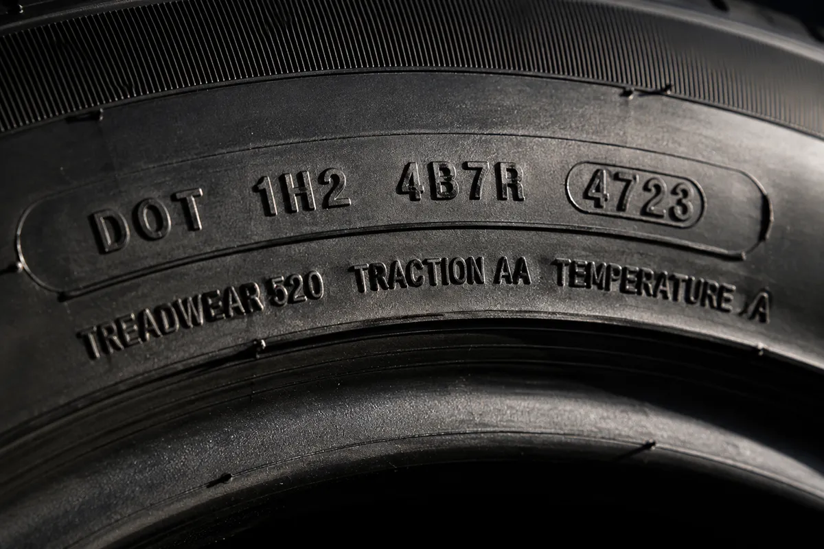 Goodyear tire sidewall showing the DOT code and UTQG treadwear rating